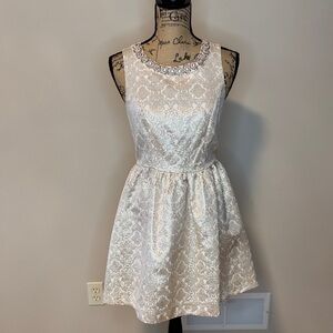 Romeo & Juliet Couture metallic Cream Dress with Embellished Neckline